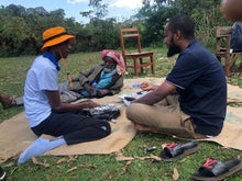 Load image into Gallery viewer, Members of the Tokuma Farmers Group of Jimma, Ethiopia, attending a group meeting, relaxing together.