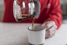 Load image into Gallery viewer, Pouring freshly brewed specialty coffee
