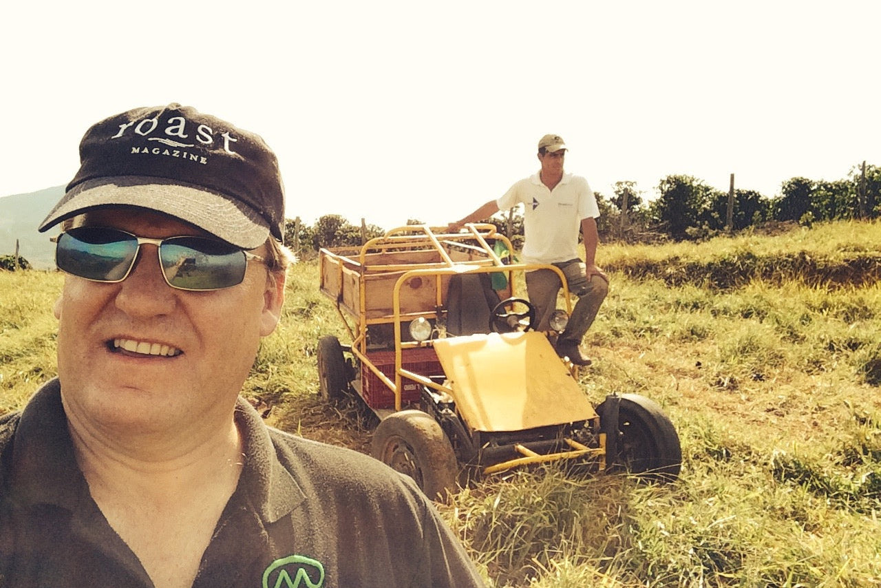Stephen Hurst, owner of Fazenda Inglaterra, with a worker on a dune buggy at Fazenda Inglaterra