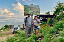 Load image into Gallery viewer, Ozone Green Buyer Roland Glew and Brenda Palli at her farm a Hermosa in Bolivia

